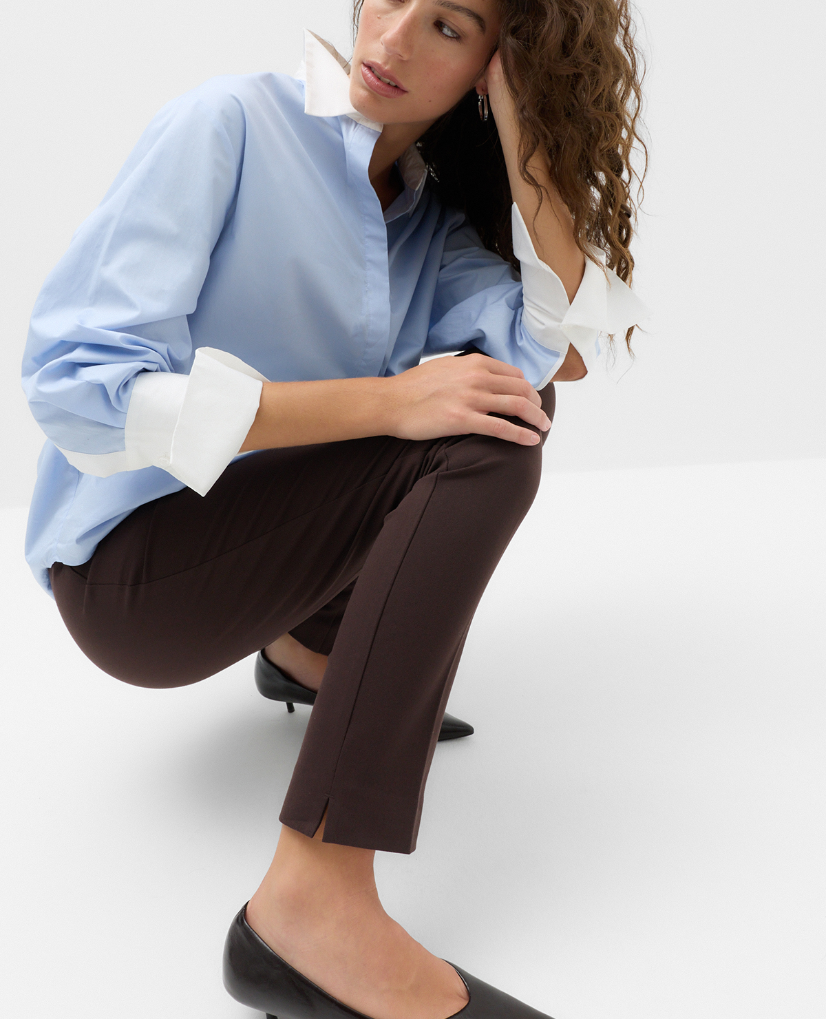 Woman wearing a Blue Shirt with Chocolate Slim Fit Ankle Grazer Trousers