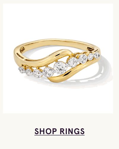 Gold band with curving design nestled with round diamonds. Click here to shop rings