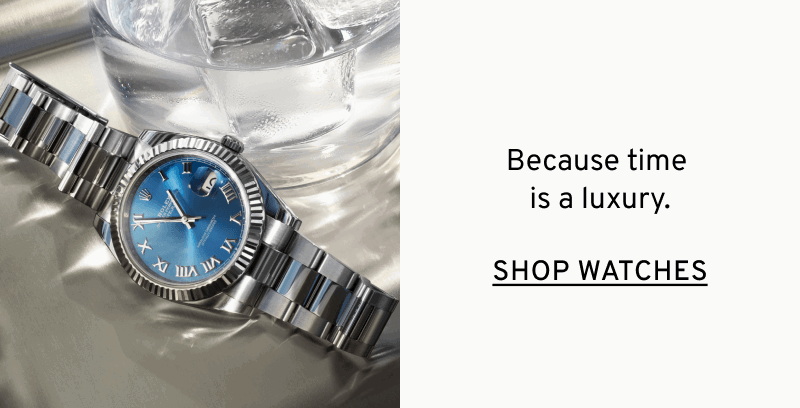 Silver men’s watch with blue face on nightstand. Because time is a luxury. Click to Shop Watches