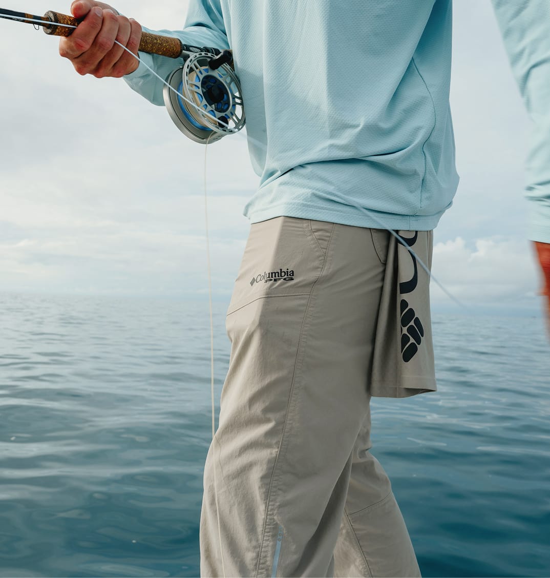 Close up of an angler's pants while they are casting. 