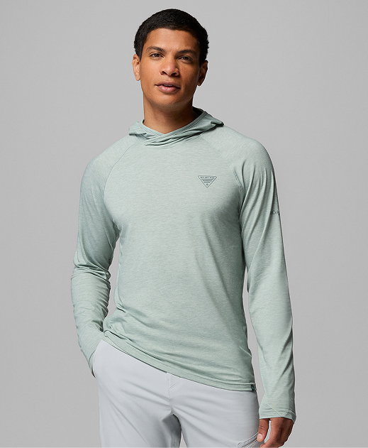 A man wearing a light green hoodie