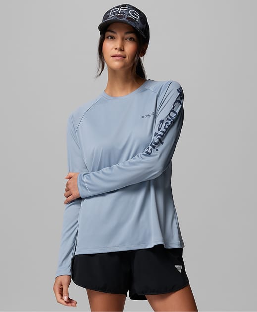 A woman wearing a light blue long sleeve shirt