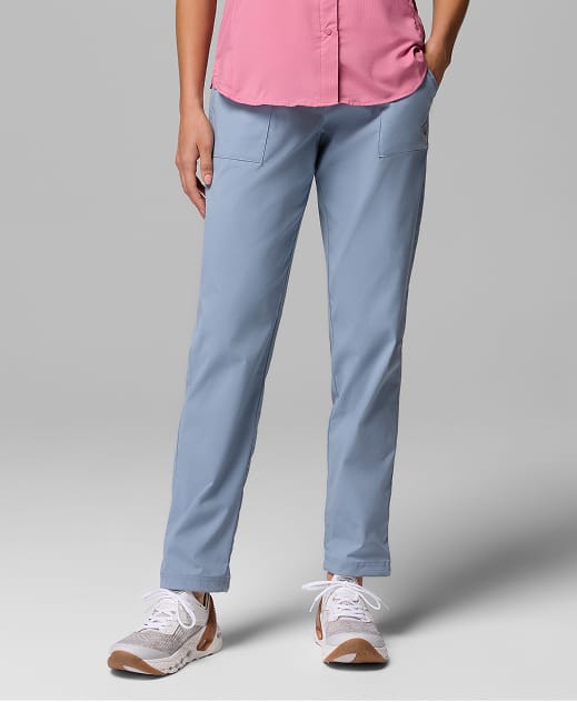 A woman wearing light blue pants