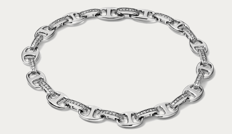 White gold hoop earrings with diamond accents.