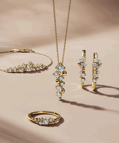 Yellow gold diamond bracelet, pendant necklace, hoop earrings and ring.