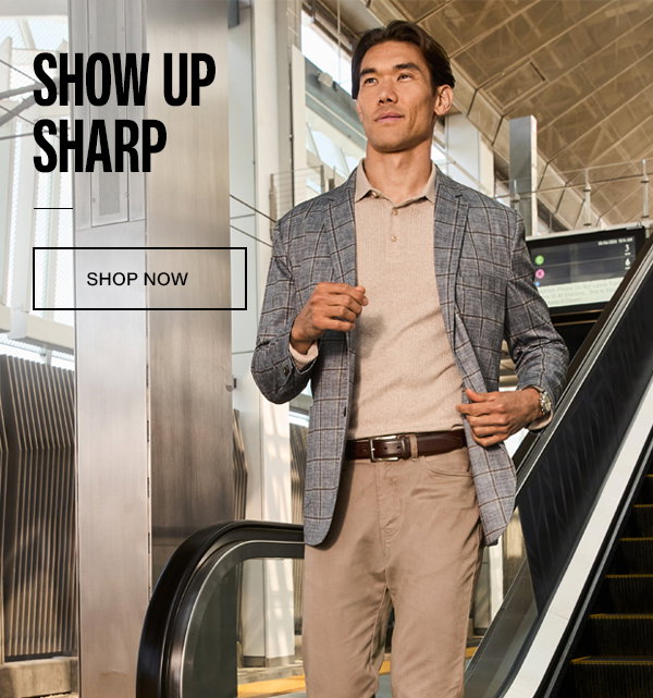 Model wearing a plaid blazer, neutral polo, and tailored pants at a Metro station. Text reads: 