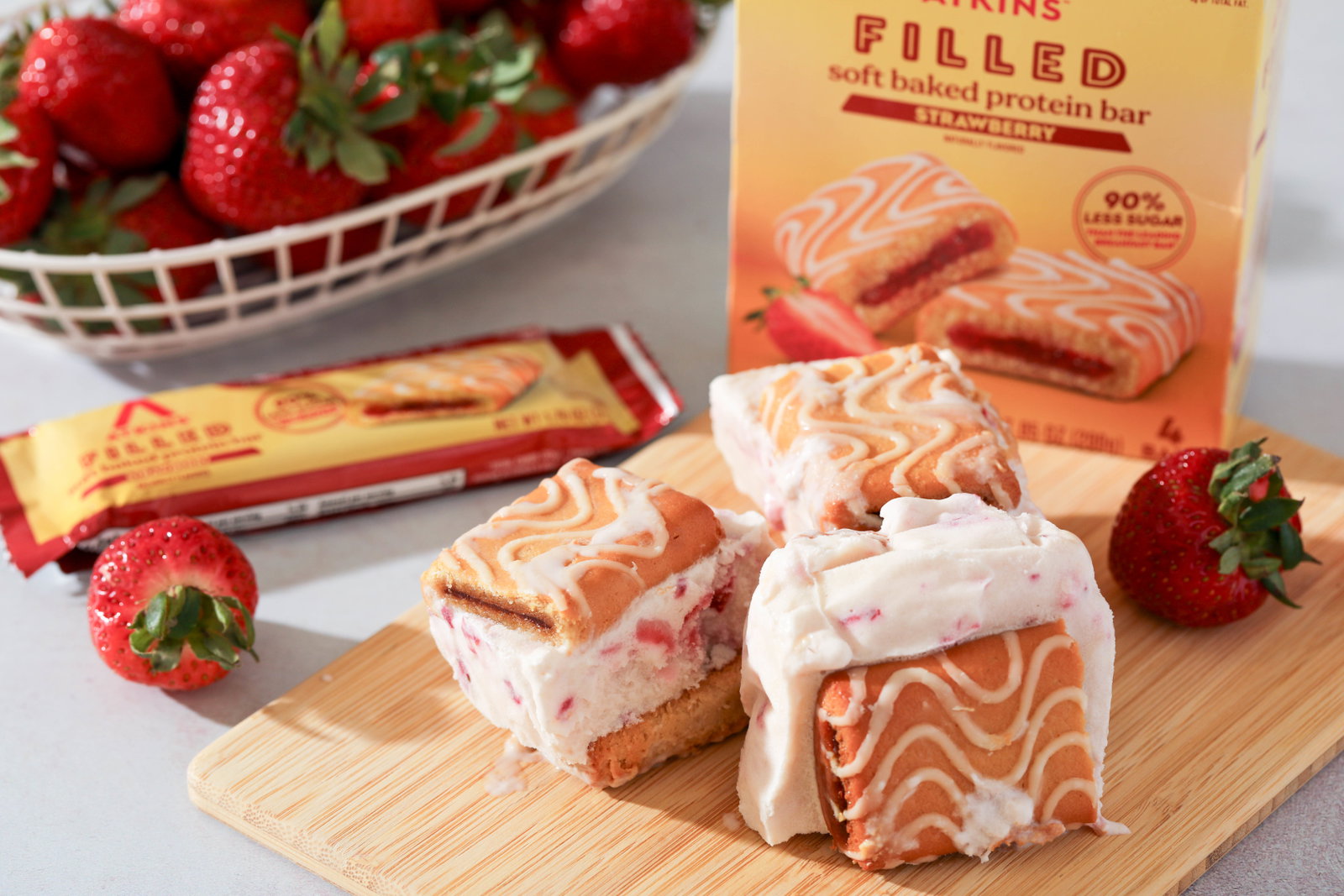 Low Carb Strawberry Ice Cream Sandwich made with New Atkins Strawberry filled soft baked protein bars 