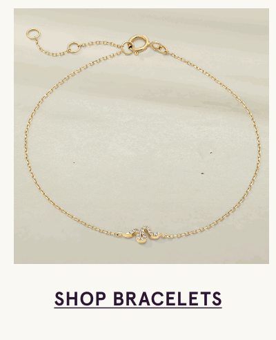 Gold chain bracelet with pave diamond snake accent. Click here to shop bracelets