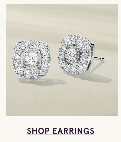 Pair of square-cut diamond cluster stud earrings. Click here to shop earrings
