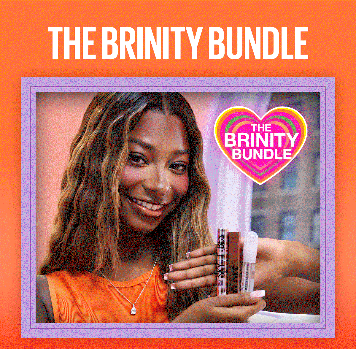A lifestyle image of reality TV star Trinity, one half of the couple nicknamed Brinity, smiling while holding the makeup products from the exclusive TikTok Shop beauty bundle. The colorful image features the headline “The Brinity Bundle” and showcases Super Stay Peel-Off Lip Liner, Lifter Gel Lip Gloss, and Sky Tubes Tubing Mascara.