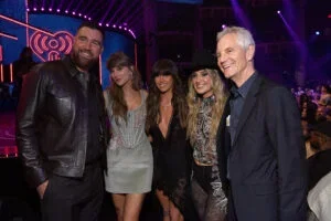 Travis Kelce, Taylor Swift, Ella Langley, Lainey Wilson, and John Sykes, President, Entertainment Enterprises for iHeartMedia, Inc. attend the 2026 iHeartRadio Music Awards at Dolby Theatre on March 26, 2026 in Los Angeles, California.