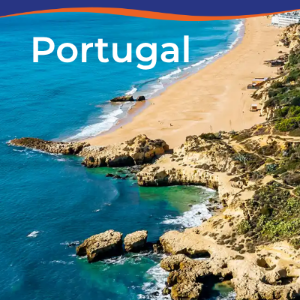 Aerial view of a sandy beach and rocky coastline in Portugal, with clear blue waters.