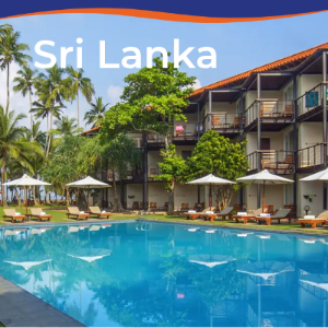 A serene hotel pool surrounded by palm trees and sun loungers in Sri Lanka.