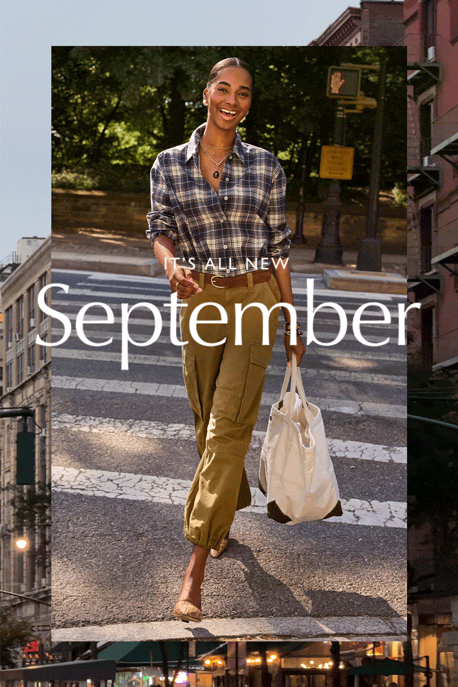 It's all new September. Fashion image of woman walking through streets in fall EVEREVE look.