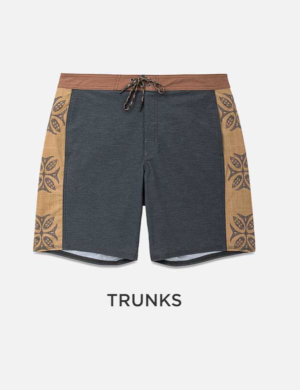Navy and tan patterned surf trunks, product flat lay
