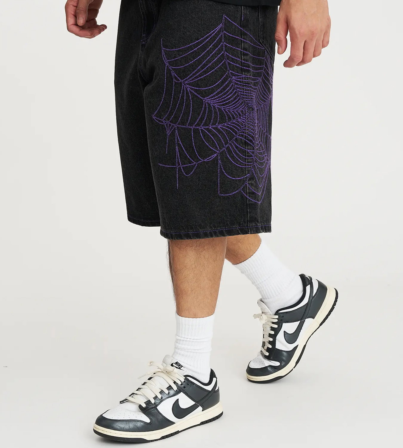 The Cobweb Baggy Fit Jorts in Washed Black. 