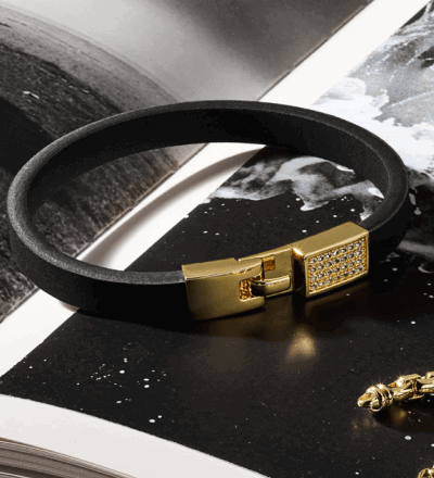 Black men’s bracelet with gold clasp.