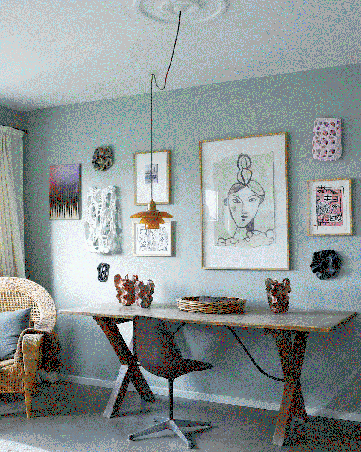 A GIF showing an office painted in a light blue and a bedroom in a dark grey.
