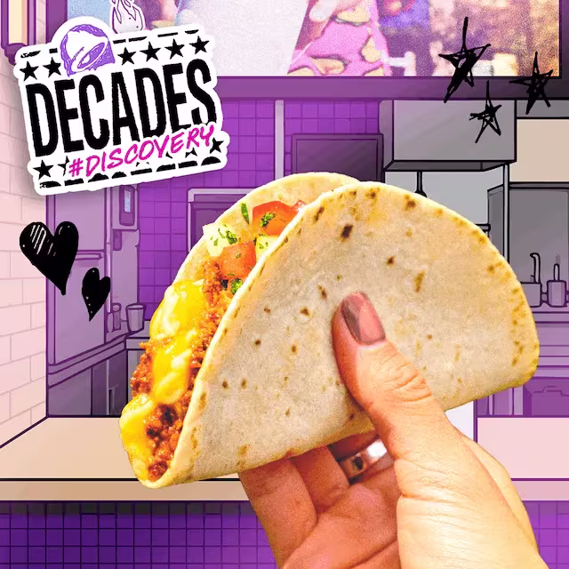 Decades #Discovery. A hand holding a Taco Bell Meximelt.