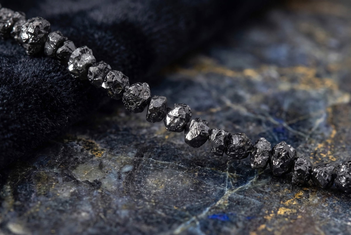Close view of the irregular raw black diamonds in the 25 carat bracelet