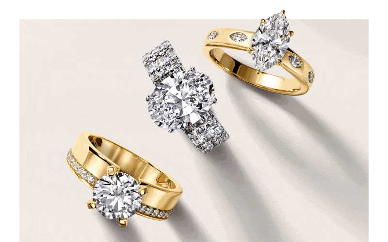 Assorted engagement rings. Diamond wedding bands. Stacked rings in yellow and white gold.