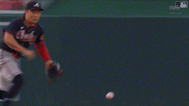 An animated gif of Ha-Seong Kim making a sliding, spinning stop and throwing to first from the ground