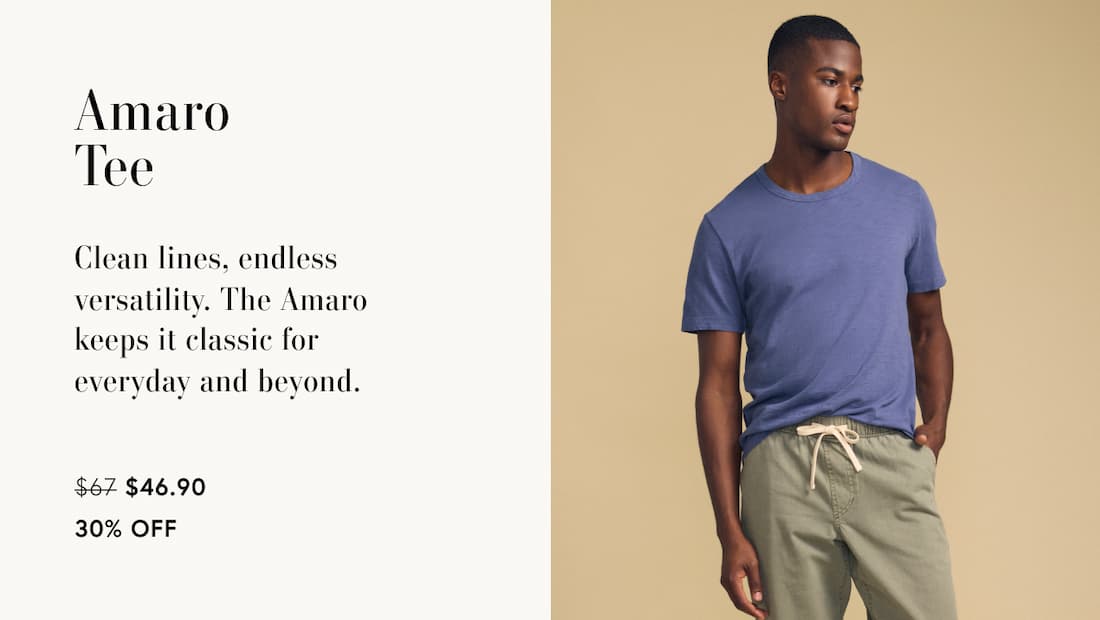 Image of model wearing Amaro in Indigo. Text Reads: Amaro Tee. Clean lines, endless versatility. The Amaro keeps it classic for everyday and beyond.