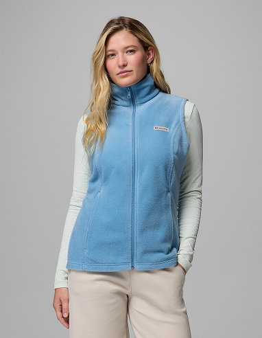 A woman wearing a blue vest.