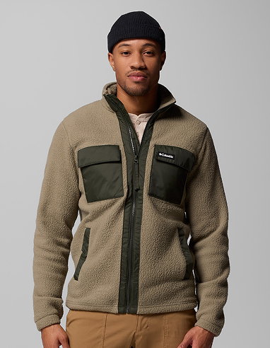 A man wearing a green fleece jacket.