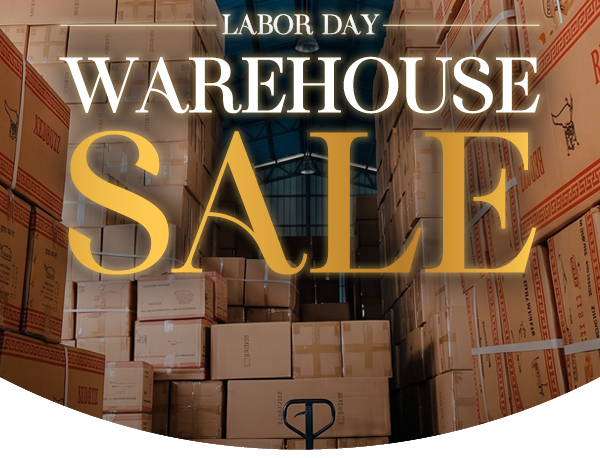 Image of a stack of boxes in a warehouse with "WAREHOUSE SALE" in large lettering 