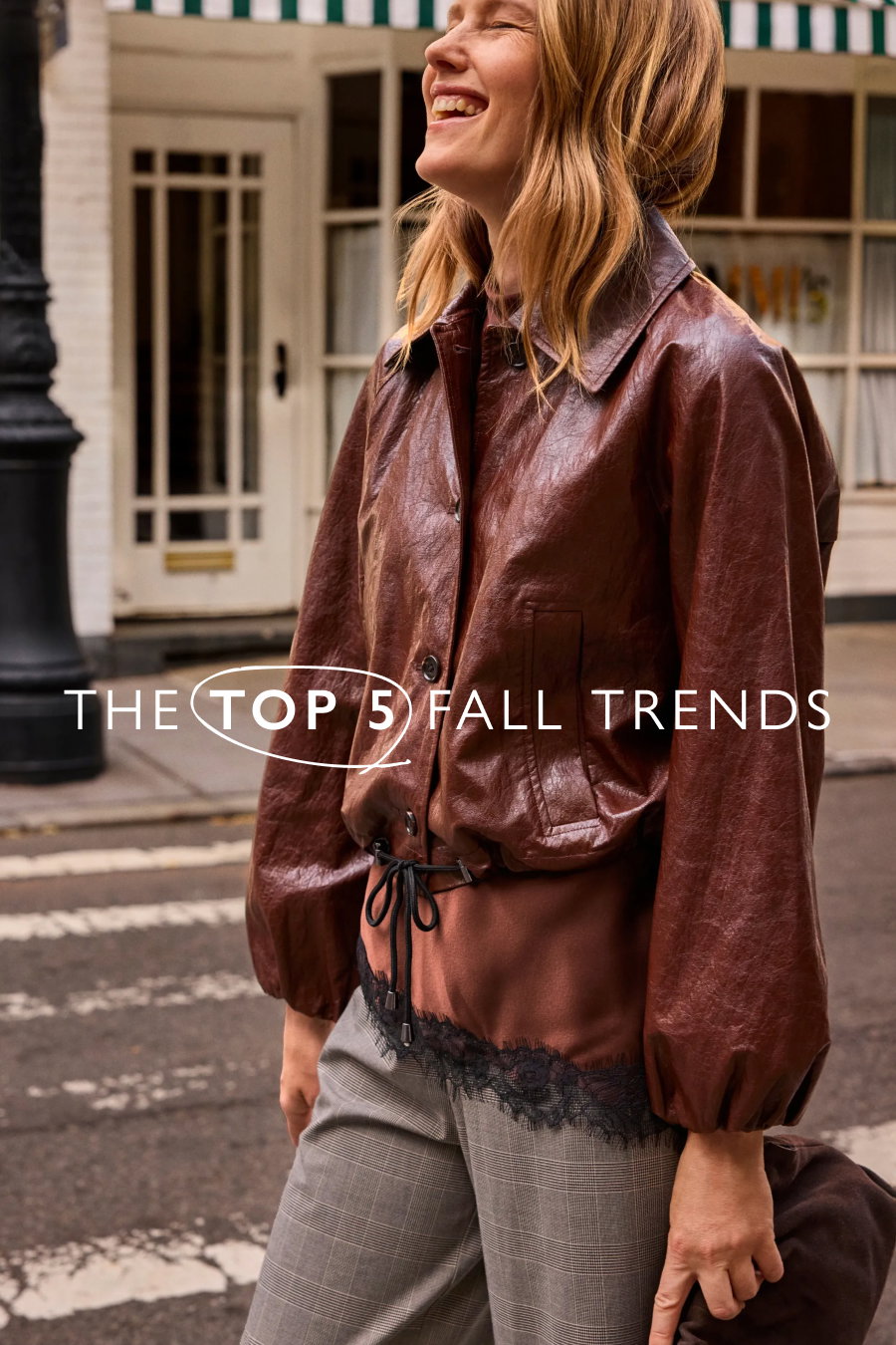 The Top 5 Fall Trends. Image of model smiling in trendy fashion.