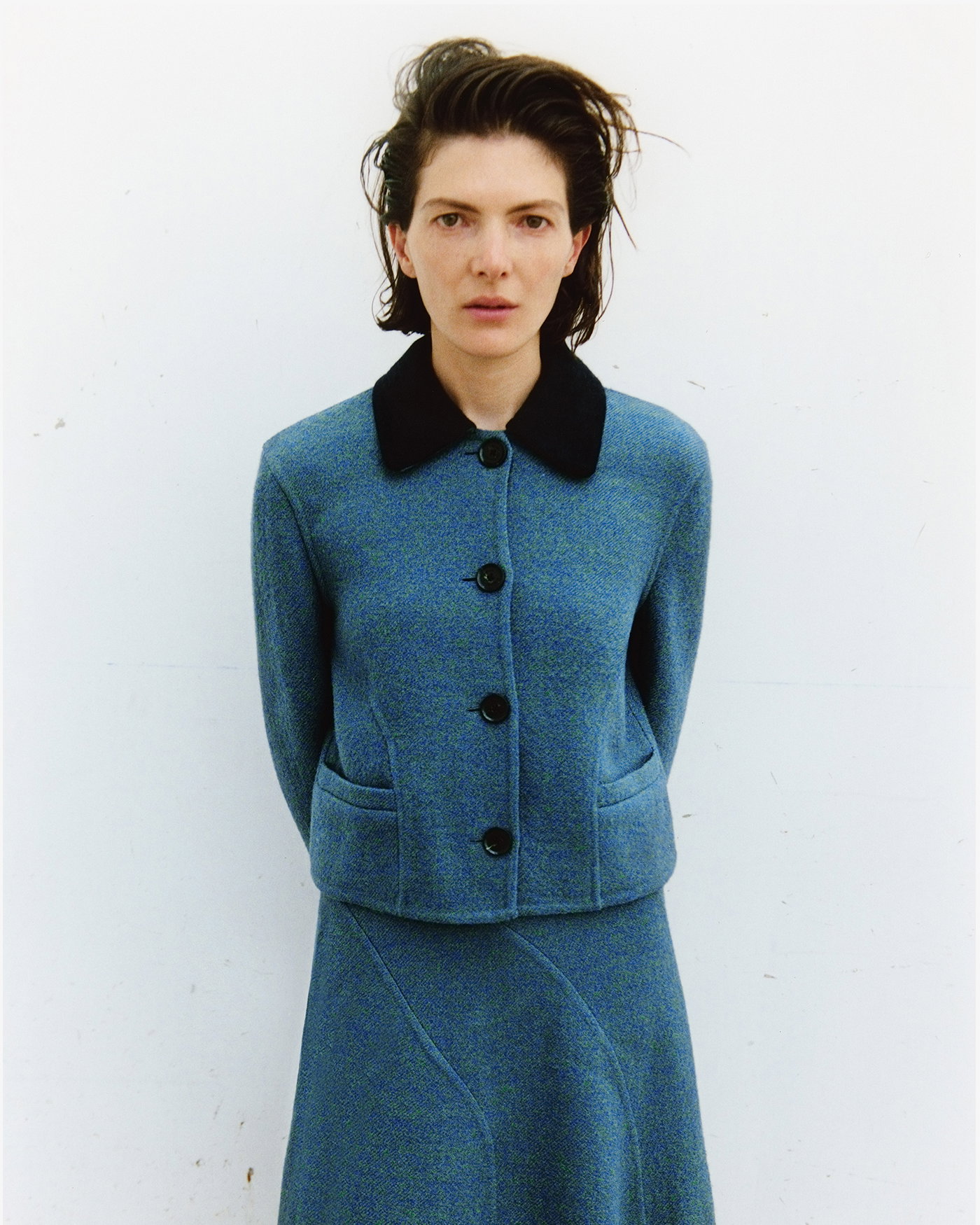 Cropped campaign image of model wearing the Gaelle Jacket in Double Face Melange Outerwear in Green/Midnight Multi with the Gaelle Skirt in Double Face Melange Outerwear in Green/Midnight Multi