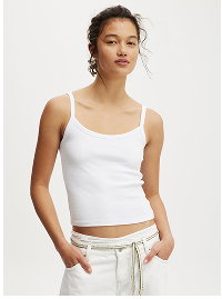 Woman wearing white ribbed tank top and drawstring pants