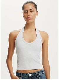 White halter neck crop top on model