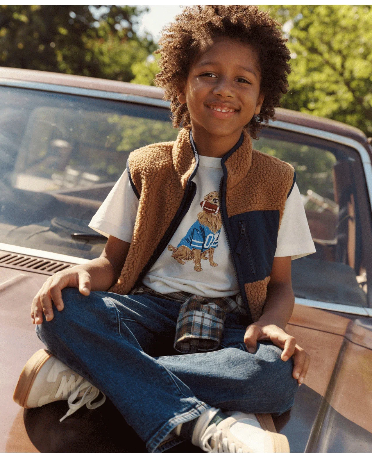 Sherpa vest layered over a graphic tee.