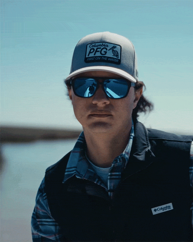 Video of two anglers on a boat, reeling in fish, driving a skiff, etc.