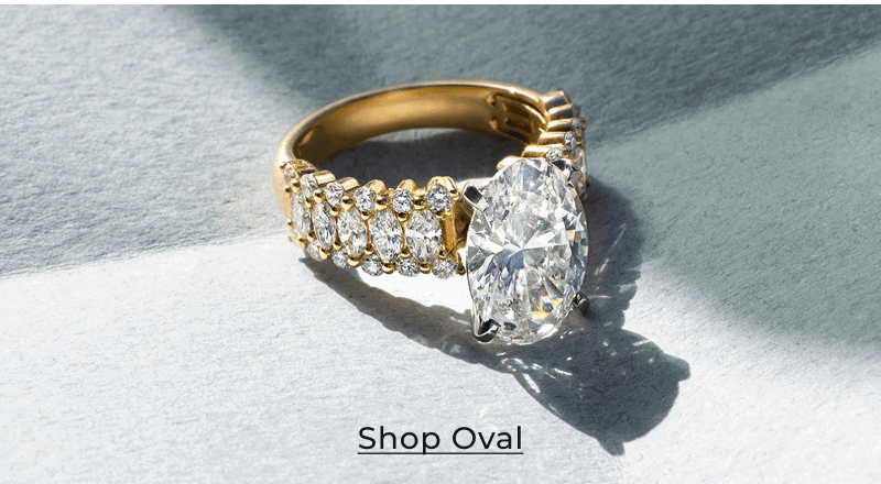 Oval diamond ring on folded paper. Click to Shop Oval