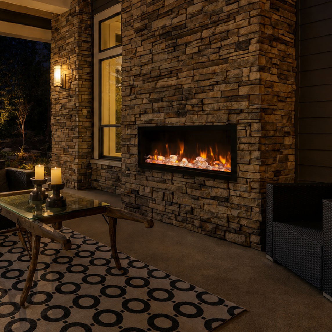 Cozy patio with fireplace and candles.