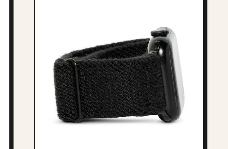 A close-up of a black Braxley band on an Apple Watch.