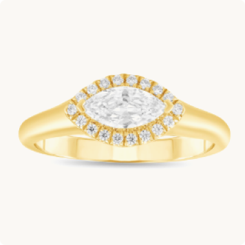 Marquise Lab Grown Diamond Horizontal Halo Engagement Ring in 14k Yellow Gold: Marquise-cut diamond ring surrounded by a halo of round diamonds, set in yellow gold.