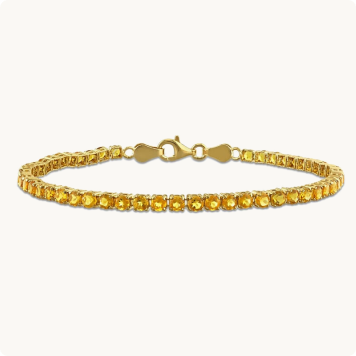 Madeira Citrine Tennis Bracelet in Gold Plated: Yellow gold tennis bracelet lined with round citrine gemstones.