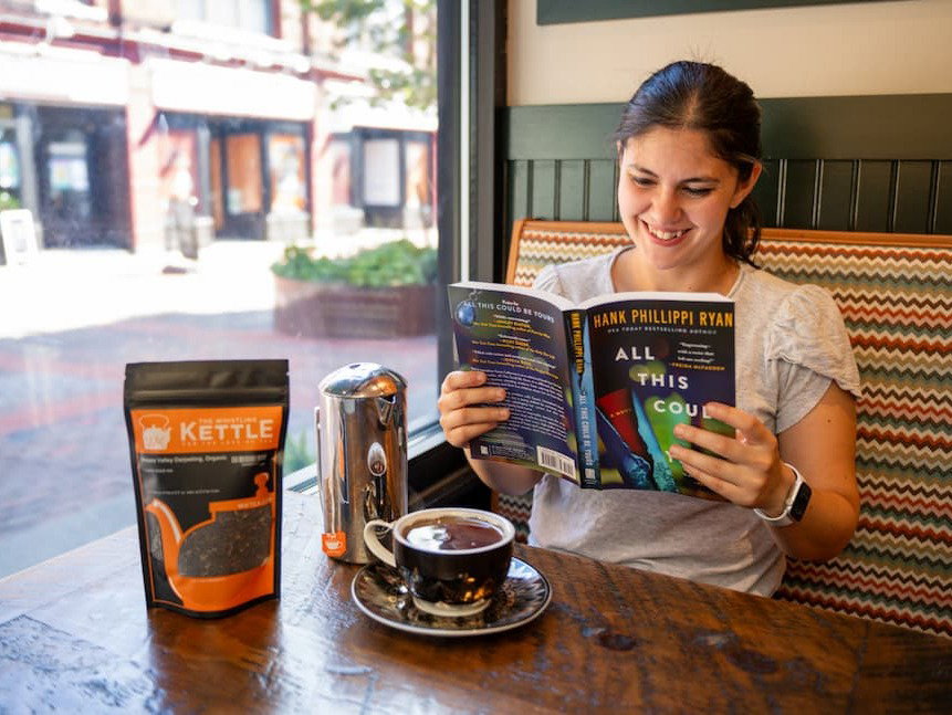 girl holdingall this could be yours book and hot darjeeling happy valley