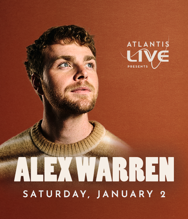 Alex Warren smiling and looking over to one side with Atlantis Live logo.