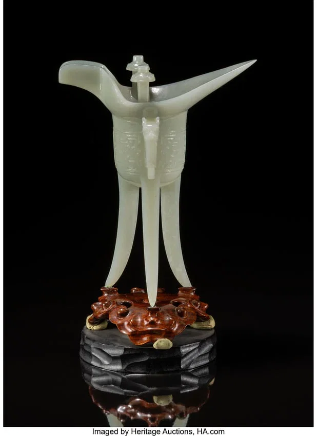 27061&colon; A Chinese Carved Celadon Jade Jue Cup&comma; 20th cent