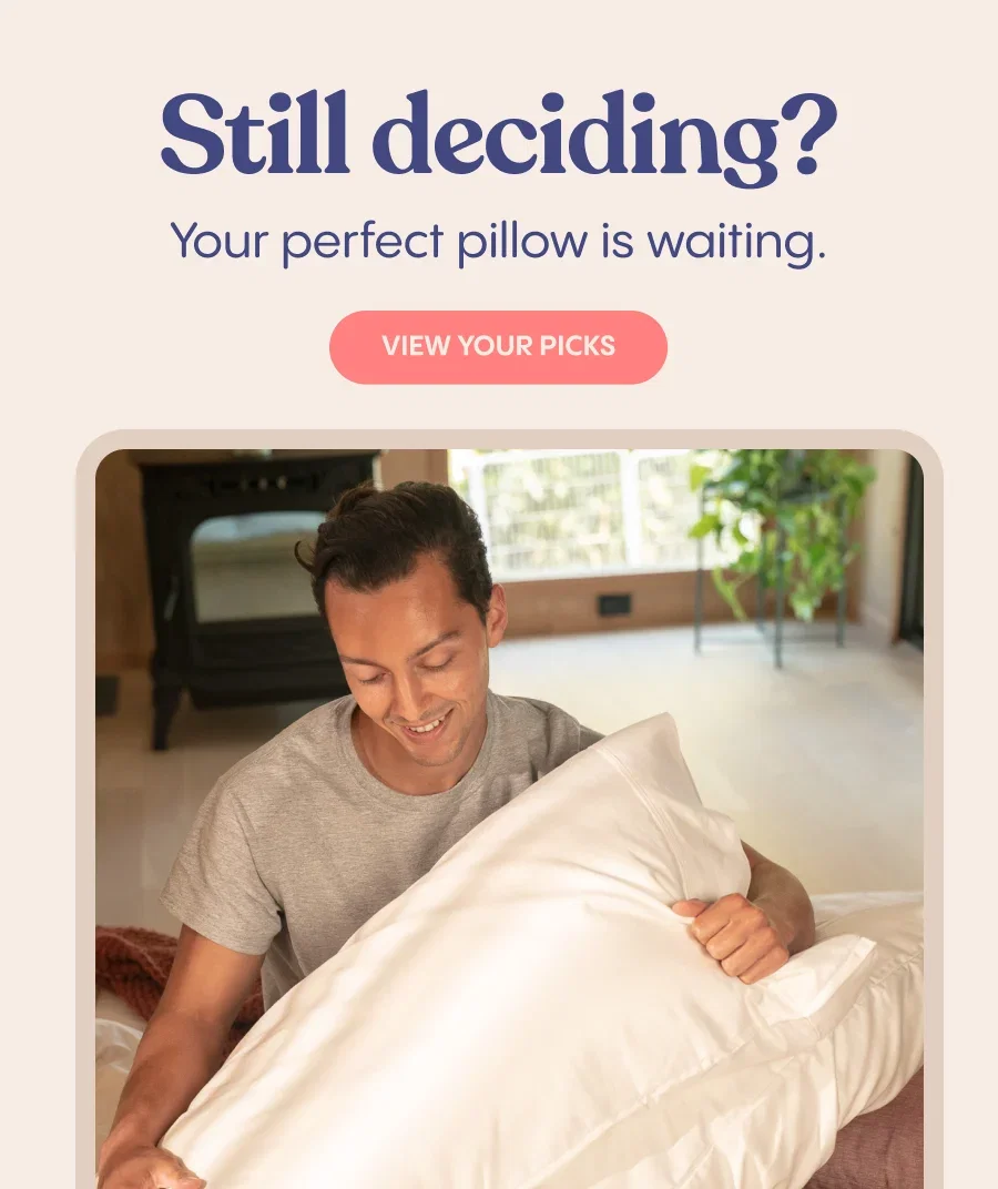 A medium shot shows a man in a grey t-shirt holding a white pillow with a textured brown blanket to his left, with the text 'Still deciding? Your perf...
