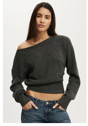 Woman wearing charcoal off-shoulder crop sweater with jeans