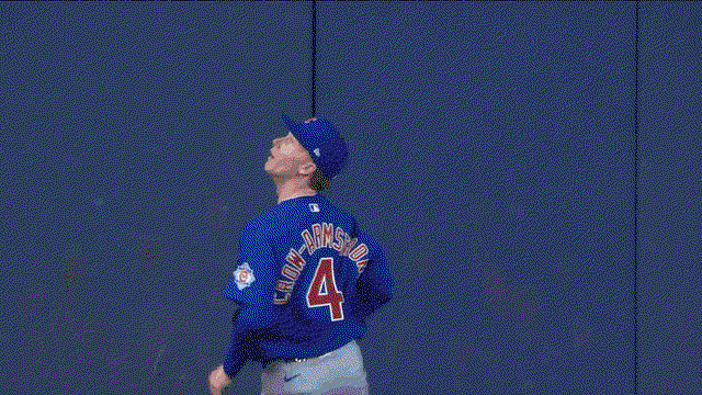 An animated gif of Pete Crow-Armstrong making a leaping catch at the wall