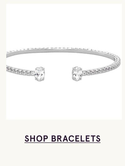 Open-ended silver bangle with two diamonds on each end. Click here to shop bracelets