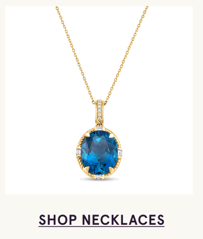 Gold chain with large, deep blue pendant with dainty engaved stones. Click here to shop necklaces