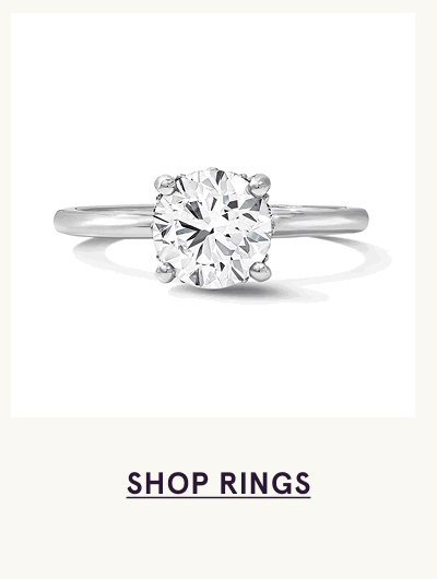 Silver ring with bold, round-cut centered diamond stone. Click here to shop rings